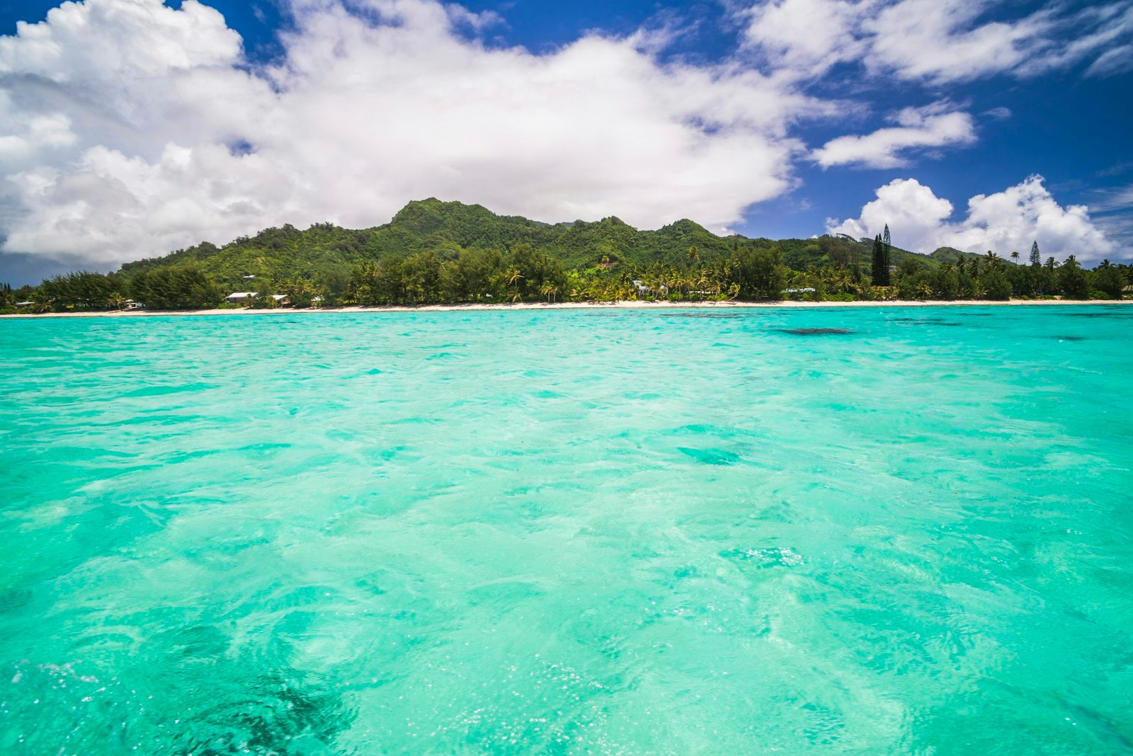 Tropical Island of Rarotonga seen from the beautiful crystal clear Pacific Ocean at Muri Lagoon, Rar